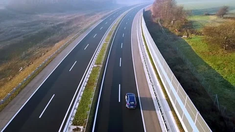 Lone car on the highway Stock Footage 136541240