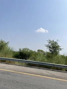 Lone Cloud Over the Roadside Stock Photos
