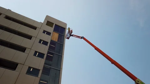 Lone construction worker atop a crane Stock Footage 109457529