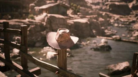 A lone cowboy hat resting on a post near a calm riverbank at sunset Stock Illustration