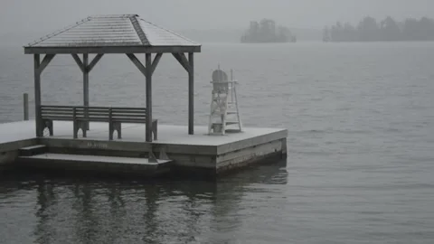 A lone dock is mirrored in the lake 스톡 동영상 166570199
