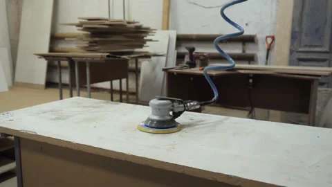A lone grinder is lying on the table waiting for the master. Stock Footage 152386876