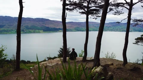 Lone Hiker Enjoying Panoramic View from Kodak Corner Above Carlingford Lough Stock-Footage 337008521