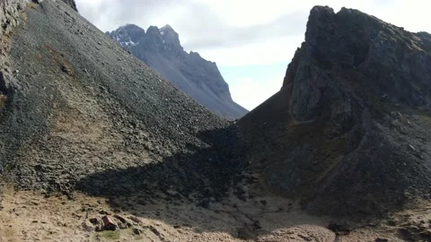 Lone Hikers between massive mountains in Iceland - Exclusive Cinematography Stock Footage 154428885