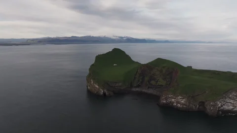 Lone home on an island between mainland Iceland and the Westman islands Stock Footage 279474635