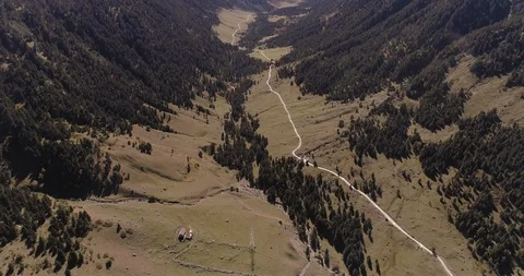 Lone house in mountains with single path up huge valley drone aerial 4k Stock Footage 125757265