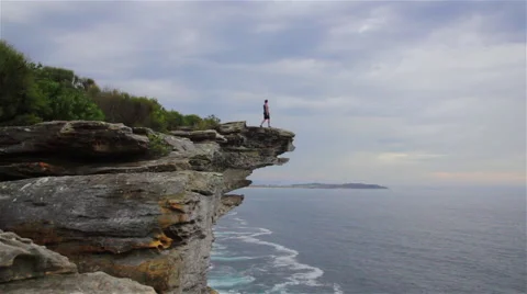 Lone Man Running on Cliff Stock Footage