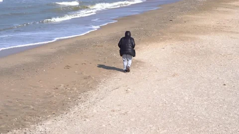 Lone Man Running By The Sea Stock Footage 200415458