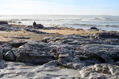 Lone man walking on the rocks Stock Photos