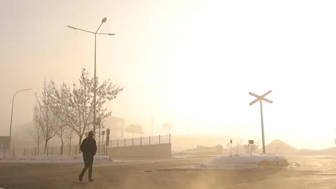 Lone Man Walking Through Thick Fog at -50°C in Erzurum, Turkey, Early Morning Stock Footage 294809156