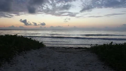 Lone Man Walks Down to Seashore at Sunrise (HD) Stock Footage 9869903
