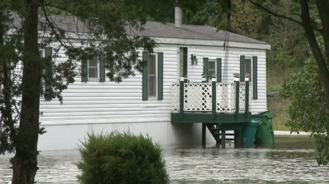 A lone mobile home is surrounded by flood waters after Hurricane Irene Stock Footage 8567333