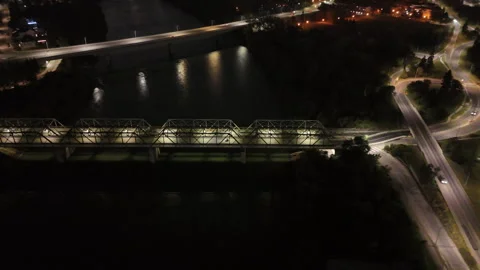 A lone motorcycle on a bridge at night Stock Footage 316176267
