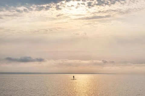 Lone paddleboarder Stock Photos