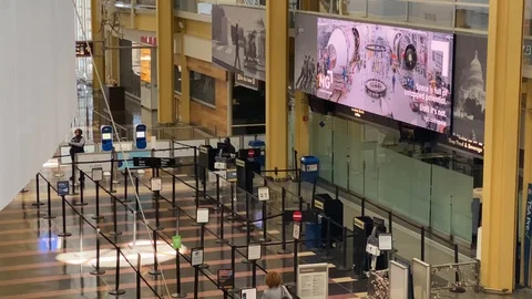 Lone passenger at TSA Checkpoint due to COVID-19 Restrictions Stock Footage 127669987