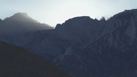 Lone Pine - Light from Behind Siera Nevada Mount Whitney Peak Stock Footage 106591284