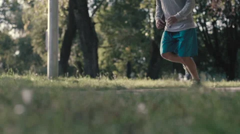 Lone runner in park, slow motion shot at 240fps Stock Footage 54056557