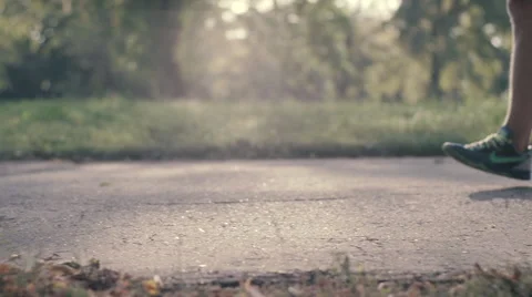 Lone runner in park summer, slow motion shot at 240fps Stock Footage 54056954