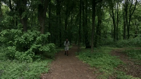 Lone runner in wintry wood, slow motion shot 스톡 동영상 75539769