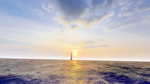 A lone sail advances in the setting sun Stock Footage 228707321