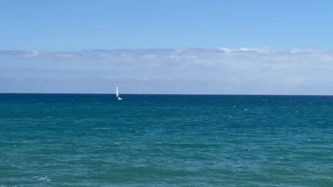 Lone Sailboat on Clear Ocean Stock Footage 287954728