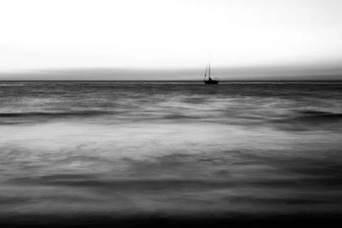 Lone ship in the ocean. Stock Photos