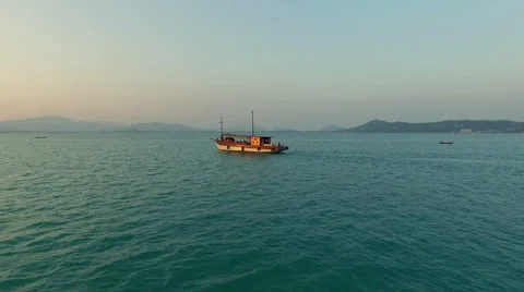 A lone ship at sea. The drone is approaching. Aerial video. N. Stock Footage 64777891