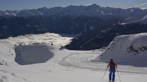 Lone skier coming down the mountain Stock Footage 72381594