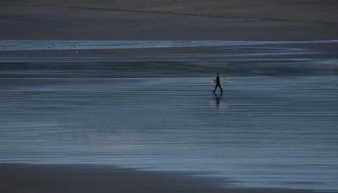 Lone Surfer At The Beach Fotos de archivo