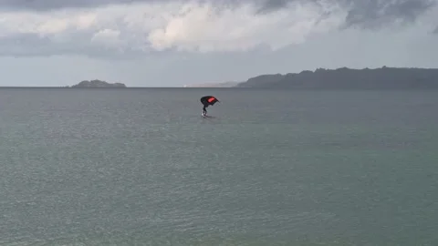 Lone surfer with a prototype wind wing Stock Footage 141280708