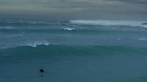 Lone Surfer Waiting Beyond Rolling Waves Stock Footage 331275906