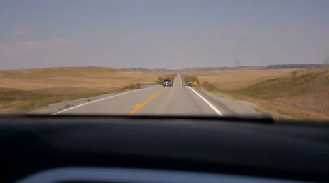 A lone truck approaches the camera while driving on a two lane rural road Stock Footage 63117785