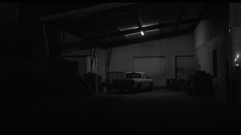 Lone Truck under Light surrounded by Auto Parts Stock Footage 90270695