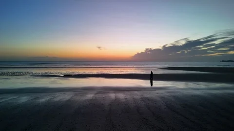 Lone walker at the Beach Stock Footage 260225190