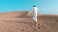 Lone Wanderer In Desert, Cinematic Drone Aerial, Man In Traditional Outfit 4K Stock Footage