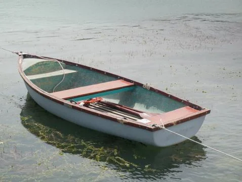 Lone white boat floating 写真素材