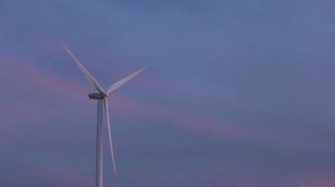 Lone Wind Turbine with Pink Clouds Stock Footage 7745925