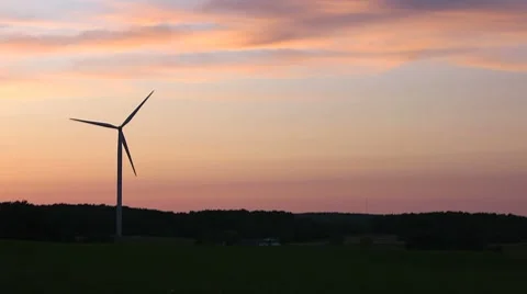 Lone Wind Turbine at Sunset Stock Footage 7745937
