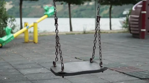 Loneliness empty swing on park Stock Footage 67364171