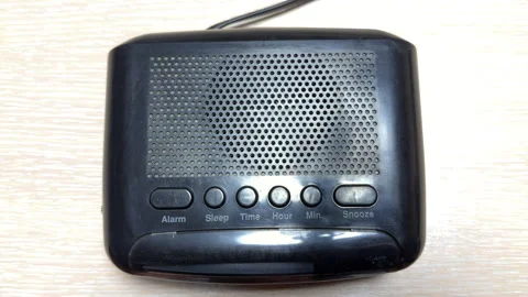 Loneliness of Empty Waves: Alarm Clock Hisses with Piercing Radio Static Stock Footage 328917625