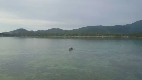 Lonely Abandoned Fisherman Boat in Sea. Aerial View Stock Footage