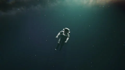 A lonely astronaut looking at something in space Stock Footage 253568361