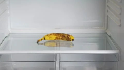 A lonely banana in an empty refrigerator Stock Footage 323431901