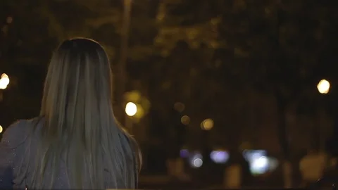 Lonely blonde at night in the Park Stock Footage 78693767