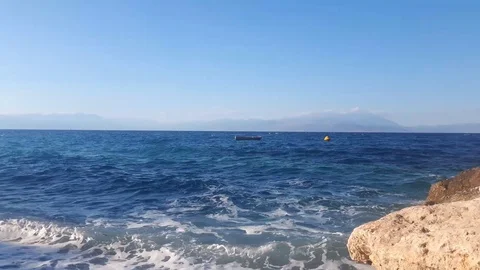 Lonely boat floating on waves, in windy sea Stock Footage 93667606