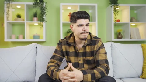 Lonely bored man thoughtful, does not know what to do. Stock-Footage 237345747