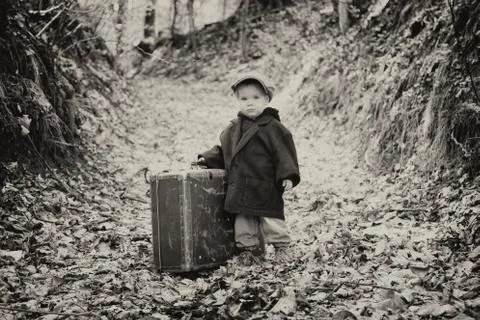 Lonely boy with suitcase, vintage Stock Photos