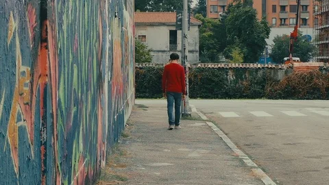 Lonely Boy Turns Around the Corner Stock Footage 87201666