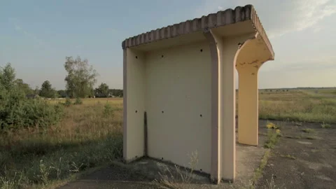 Lonely bus stop in the field, panoramic wide view Stock Footage 99480749