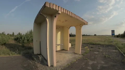 Lonely bus stop in the field, panoramic wide view on the fisheye lens Stock Footage 99480942